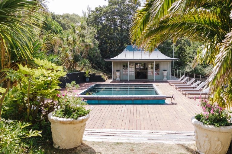 swimming pool with sunbeds