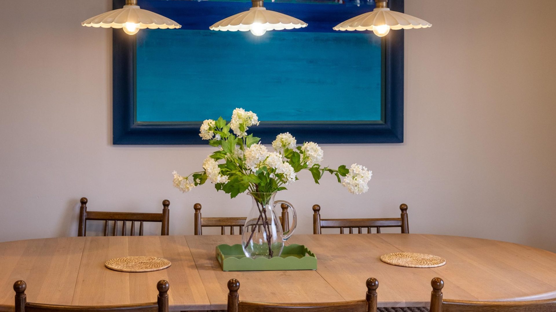 dining table and chairs with pendant lights