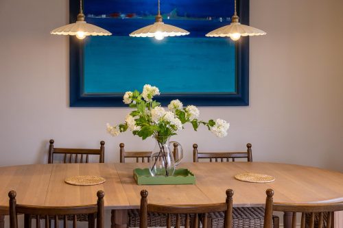 dining table and chairs with pendant lights