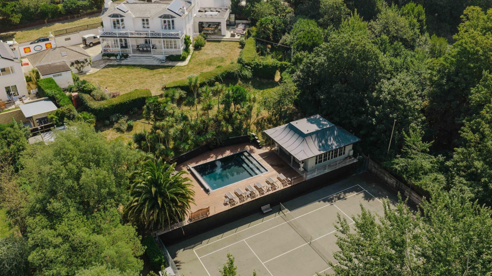 large unique home set in expansive grounds with private swimming pool and tennis courts. accommodating large groups