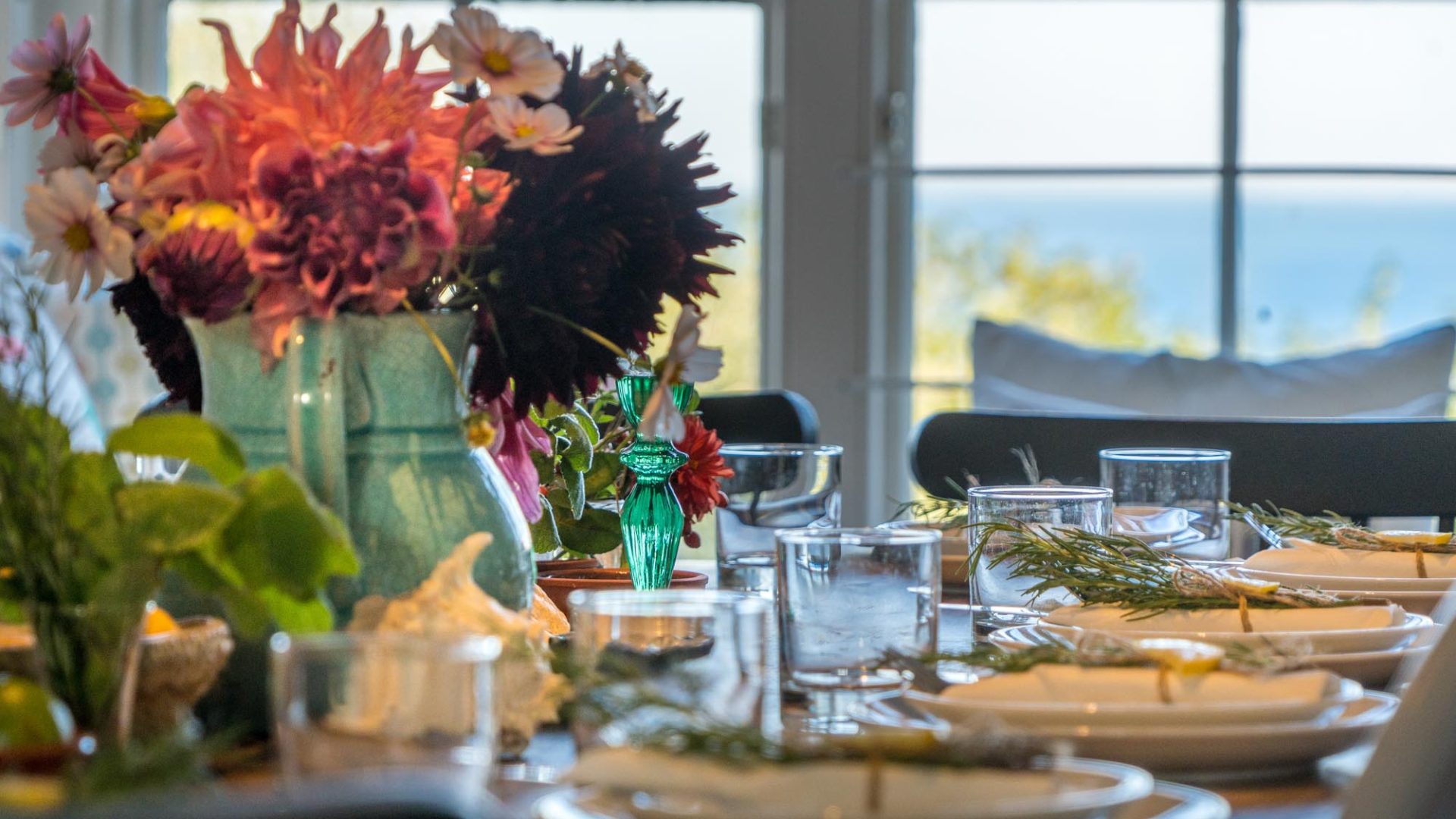 large dining table laid up for easter breakfast views out over the sea