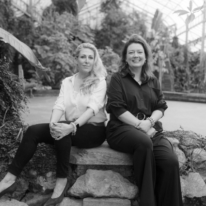 directors of curated spaces sat on a wall
